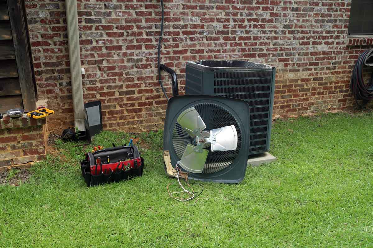 Air conditioner in the process of getting condenser coils replaced